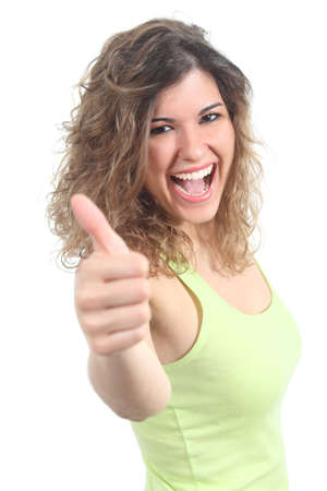 Portrait of a pretty teen with thumb up gesture on a white isolated backgroundの写真素材