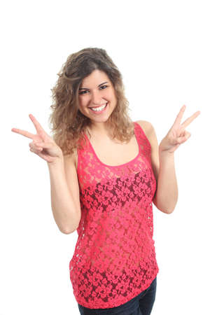 Young beautiful woman making victory or peace gesture isolated on a white backgroundの写真素材