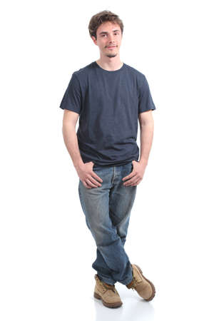 Young man smiling with his hands in the pockets on a white isolated background            の写真素材