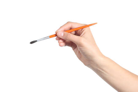 Woman hand using a little paintbrush isolated on a white backgroundの写真素材
