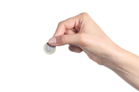 Woman hand putting an euro coin isolated on a white background             の写真素材