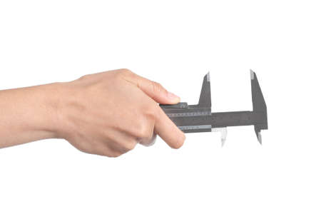 Woman hand measuring with a caliper isolated on a white backgroundの写真素材