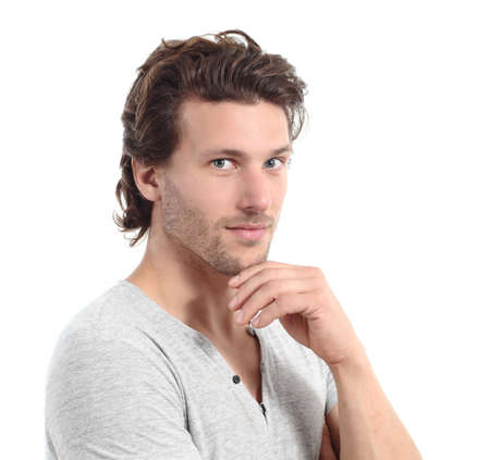Sexy man looking at camera with the hand on the chin isolated on a white background                の写真素材