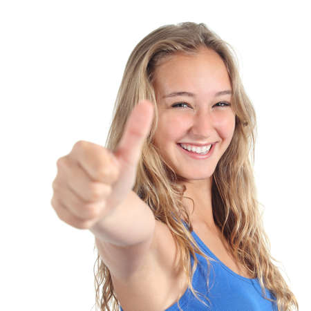 Close up of a beautiful teenage girl with thumb up isolated on a white backgroundの写真素材