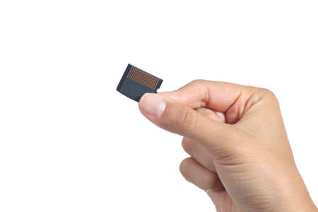 Woman hand holding a sd memory card isolated on a white background               