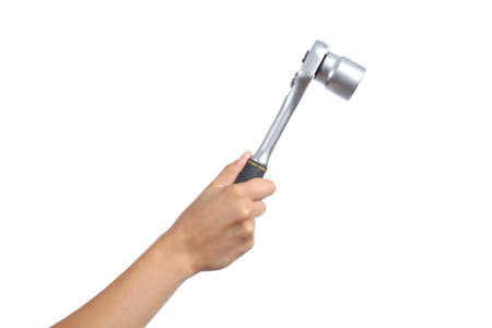 Woman hand holding a ratchet isolated on a white background             