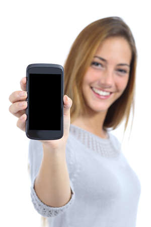 Happy pretty woman showing a blank smart phone screen isolated on a white background                の写真素材