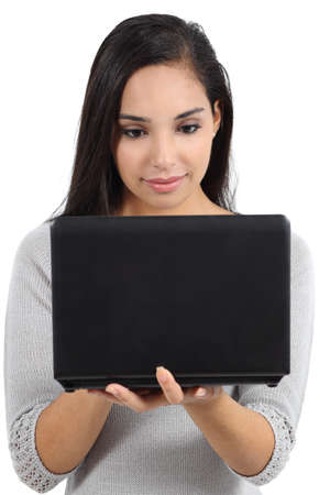 Beautiful arab woman browsing social network in a notebook computer isolated on a white の写真素材