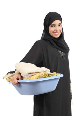Beautiful arab woman carrying laundry isolated on a white の写真素材