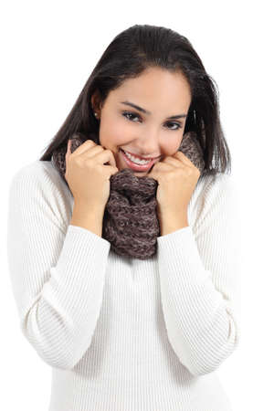 Beautiful arab woman warmly clothed grabbing a scarf isolated on a white background               の写真素材