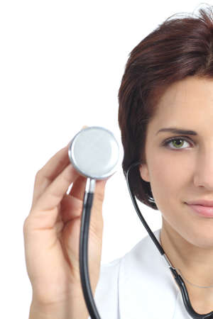 Beautiful doctor woman holding a stethoscope ready to auscultate isolated on a white backgroundの写真素材