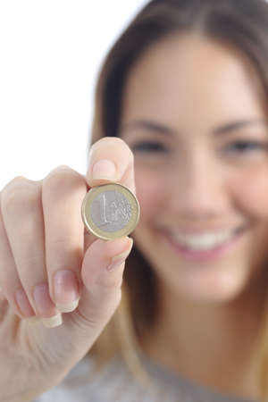 Close up of a woman hand showing an euro coin isolated on a white backgroundの写真素材