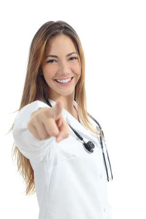 Beautiful female doctor pointing at camera isolated on a white backgroundの写真素材