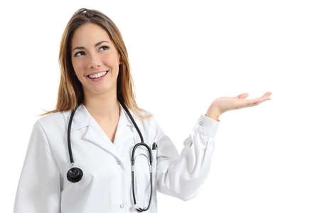 Beautiful female doctor presenting and showing copy space isolated on a white background         の写真素材
