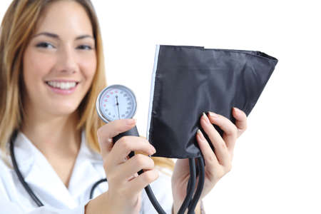 Female doctor holding and showing a sphygmomanometer isolated on a white backgroundの写真素材