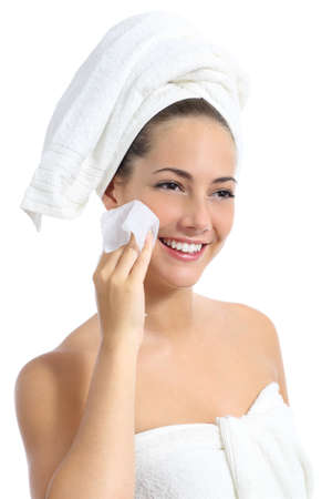 Beautiful woman cleaning her face with a baby wipe isolated on a white background              の写真素材