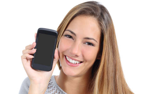 Cute girl showing a blank smart phone screen isolated on a white background             の写真素材