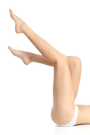 Beautiful waxing woman smooth legs pointing up isolated on a white background           の写真素材