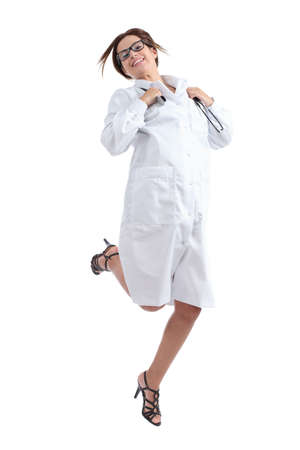 Beautiful happy female doctor jumping happy isolated on a white background            の写真素材
