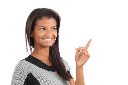 Beautiful african american girl presenting something and looking above isolated on a white backgroundの写真素材