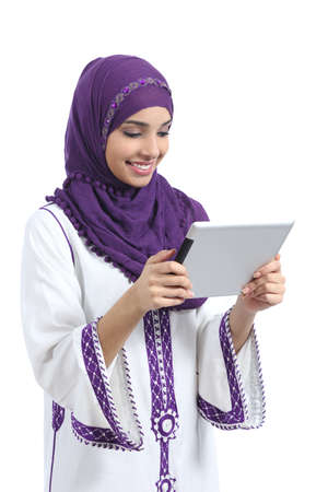 Arab woman reading a tablet reader isolated on a white background              の写真素材