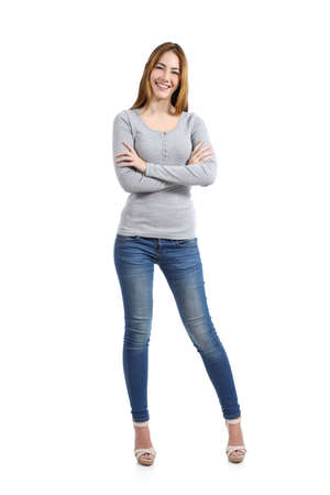 Confident full body of a casual happy woman standing wearing jeans isolated on a white background              の写真素材