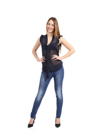Full body portrait of a casual  happy woman model standing isolated on a white background              の写真素材