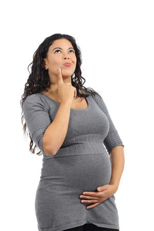 Beautiful pregnant woman thinking and looking above isolated on a white background              の写真素材