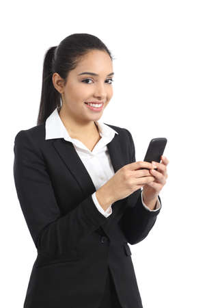 Arab business woman using a smart phone and looking at camera isolated on a white background              の写真素材