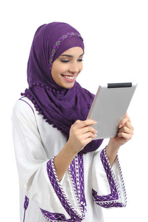 Arab happy woman reading a tablet reader isolated on a white background           の写真素材