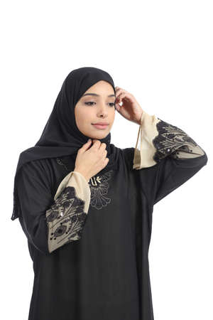 Arab saudi emirates woman dressing putting a traditional headscarf isolated on a white backgroundの写真素材