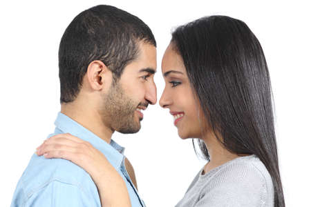 Profile of an arab couple looking each other isolated の写真素材