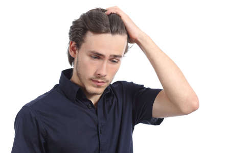 Worried depressed man with the hand on the head isolated on a white backgroundの写真素材