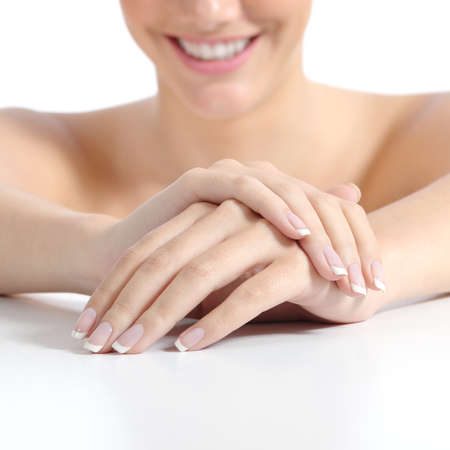 Beautiful woman hands nails with perfect french manicure isolated on a white background         の写真素材