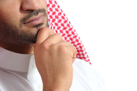 Close up of an arab saudi emirates man thinking isolated on a white background              の写真素材