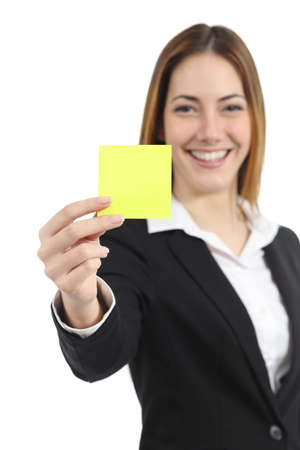 Beautiful businesswoman showing a blank yellow paper note isolated on a white backgroundの写真素材