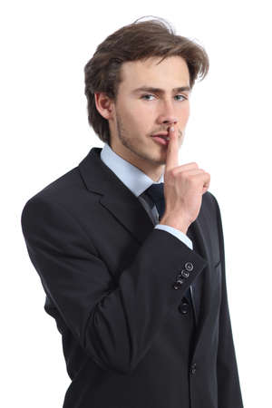 Business man asking for silence shh isolated on a white の写真素材