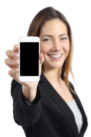 Business woman smiling showing a blank smart phone screen isolated on a white の写真素材