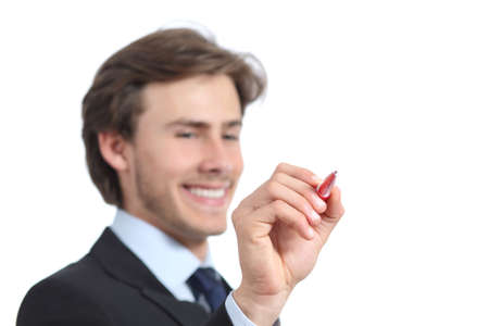 Happy businessman writing on the air with a pen isolated on a white backgroundの写真素材