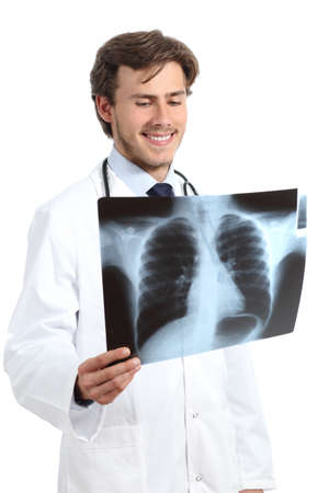 Happy doctor man examining a radiography on a white backgroundの写真素材