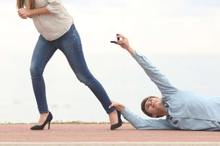 Man being rejected by his girlfriend when is proposing marriageの写真素材