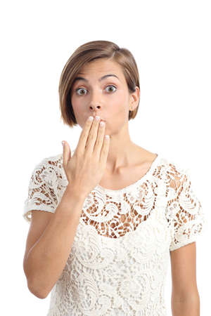 Woman in trouble gesturing oops with a hand on mouth isolated on a white backgroundの写真素材