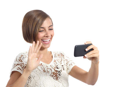Girl waving on the smart phone while during a video call isolated on a white backgroundの写真素材