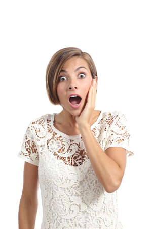 Shocked or surprised woman with a hand on face expressing wow isolated on a white backgroundの写真素材