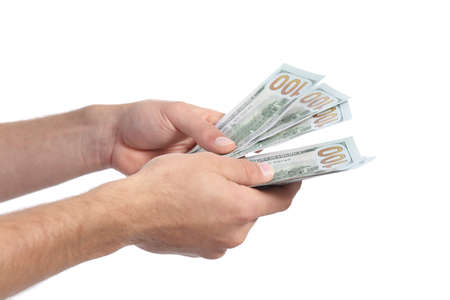 Man hands holding and counting money isolated on a white backgroundの写真素材
