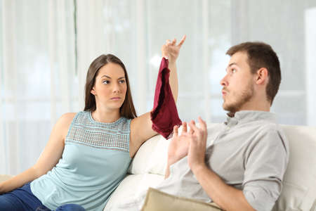 Wife finds panties on a sofa and discovers that her husband is cheatingの写真素材