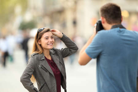 Photographer photographing to a fashion model on the streetの写真素材