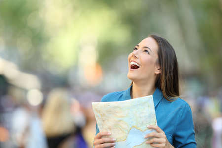 Amazed tourist contemplating landmarks on the street