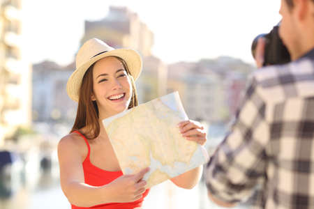 Couple of happy tourists taking photos on vacationの写真素材