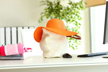 Several beach accessories at office. Vacation conceptの写真素材